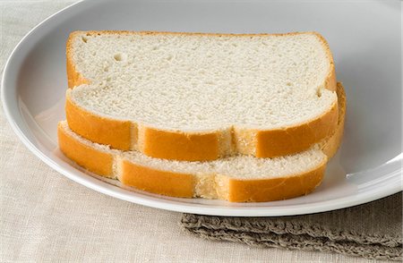 plain (simple) - Two Slices of White Bread on a Plate Stock Photo - Premium Royalty-Free, Code: 659-06372851