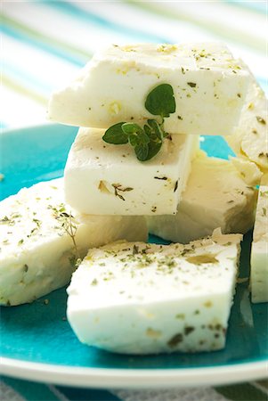 Blocks of Greek Feta Cheese with Dried Oregano on a Blue Plate Stock Photo - Premium Royalty-Free, Code: 659-06372897