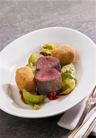 pureed - Venison fillets with potato croquettes, Brussels sprouts puree and lingonberries Stock Photo - Premium Royalty-Free, Code: 659-06373031