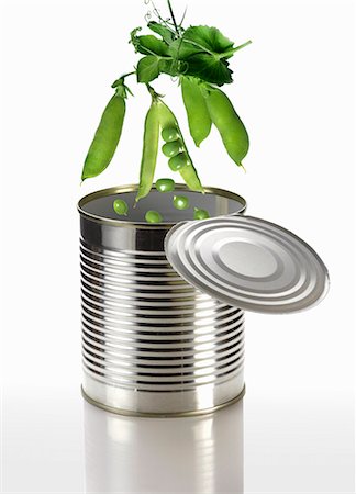 food in containers - Peas falling into a tin can Stock Photo - Premium Royalty-Free, Code: 659-06373084