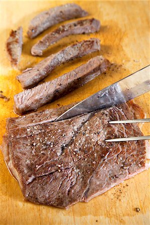 simsearch:659-08148038,k - Slicing Steak on a Cutting Board Stock Photo - Premium Royalty-Free, Code: 659-06373663