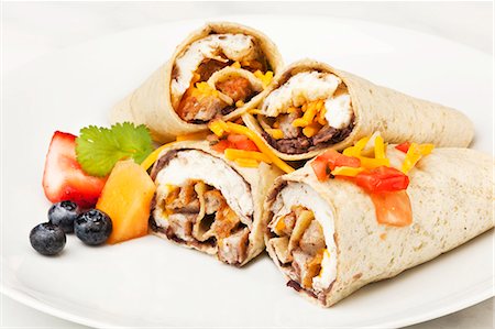 Burritos on a White Plate; Fresh Fruit Stock Photo - Premium Royalty-Free, Code: 659-06373800
