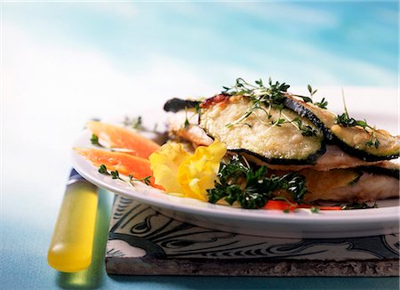 edible picture of fish - Orata in castello (sea bream with yogurt courgettes and a white wine sauce) Stock Photo - Premium Royalty-Free, Code: 659-06373832