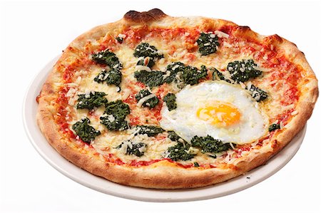 egg dish - A spinach and fried egg pizza Stock Photo - Premium Royalty-Free, Code: 659-06494236