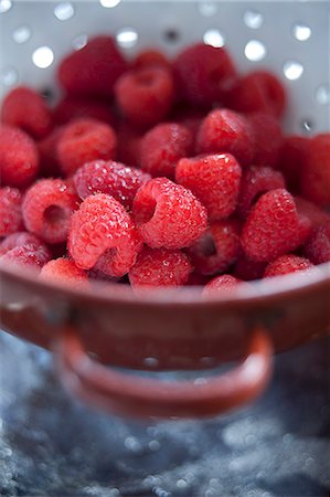 raspberry - Fresh Red Raspberries in a Small Strainer Stock Photo - Premium Royalty-Free, Code: 659-06494963