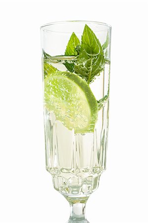 simsearch:659-06901837,k - Hugo (a cocktail with elderflower syrup, champagne and limes) Stock Photo - Premium Royalty-Free, Code: 659-06495001