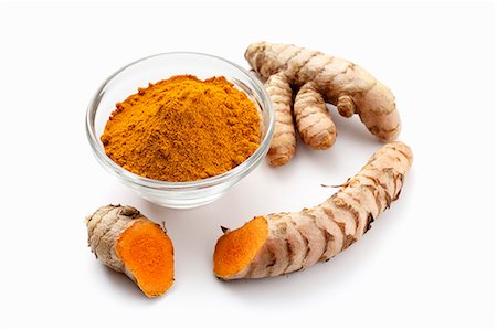 spices - Turmeric powder and turmeric roots Stock Photo - Premium Royalty-Free, Code: 659-06671302