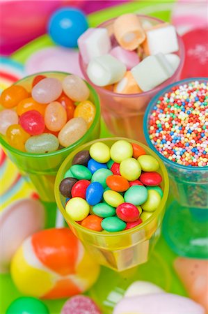 Assorted colourful sweets (jelly sweets, chocolate beans, marshmallows and lollipops) Stock Photo - Premium Royalty-Free, Code: 659-06671397