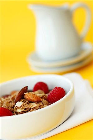 Bowl of Granola with Almonds and Raspberries Stock Photo - Premium Royalty-Free, Code: 659-06671667