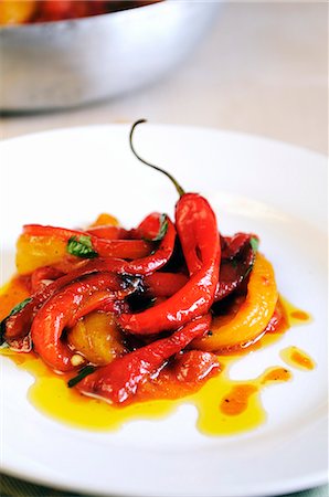 simsearch:659-06373046,k - A plate of pan cooked sweet red and yellow peppers with fresh chilies and sun dried tomatoes Stock Photo - Premium Royalty-Free, Code: 659-06900893