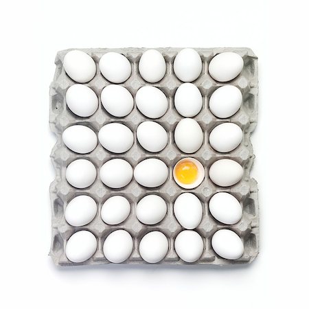 egg box - Many Whole White Eggs in a Carton; One Broken Open Stock Photo - Premium Royalty-Free, Code: 659-06901173