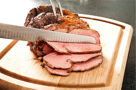 Slicing Prime Rib on a Cutting Board Stock Photo - Premium Royalty-Free, Code: 659-06901315