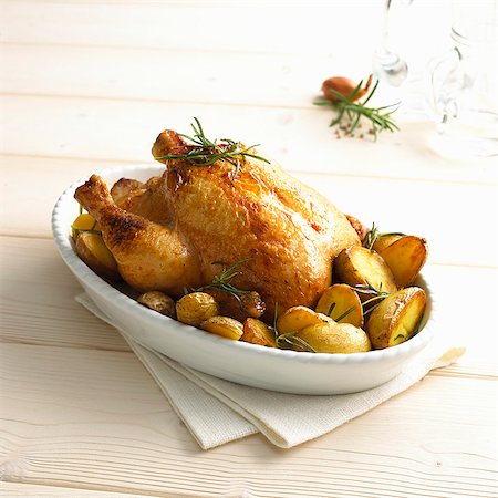 roasted - Rosemary chicken with oven potatoes Stock Photo - Premium Royalty-Free, Code: 659-06902575