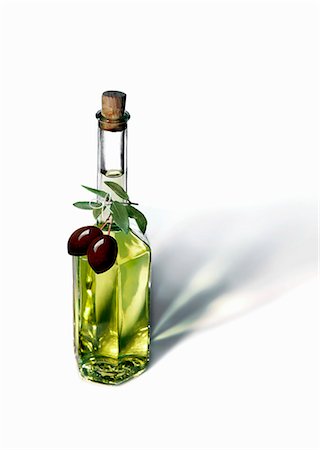 An olive oil bottle with black olives Stock Photo - Premium Royalty-Free, Code: 659-06903079