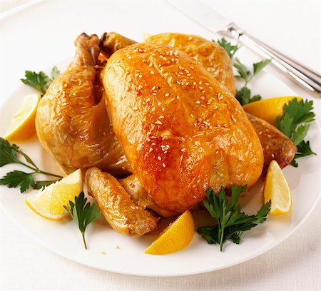 roasted (meat) - A whole roast chicken with sesame seeds Stock Photo - Premium Royalty-Free, Code: 659-06903124