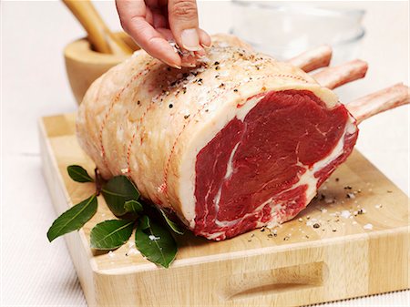 A joint of beef being seasoned Stock Photo - Premium Royalty-Free, Code: 659-06903126