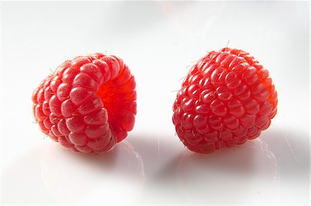 raspberry - Two raspberries Stock Photo - Premium Royalty-Free, Code: 659-06903420