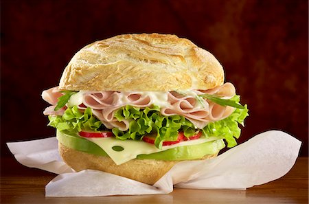 sandwich - A roll filled with cheese, ham and salad Stock Photo - Premium Royalty-Free, Code: 659-06903850