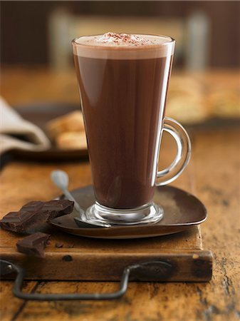 A glass of hot chocolate and pieces of chocolate Stock Photo - Premium Royalty-Free, Code: 659-06903874