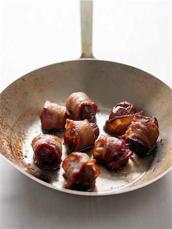 Dates Wrapped in Bacon in a Wok Stock Photo - Premium Royalty-Free, Code: 659-07026792