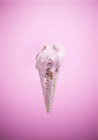 An ice cream cone with melting strawberry ice cream Stock Photo - Premium Royalty-Free, Code: 659-07026948