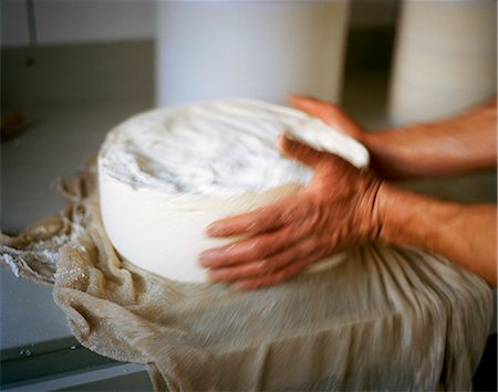 Hands Working with Urner Alpkäse (Swiss) Cheese Stock Photo - Premium Royalty-Free, Code: 659-07027128