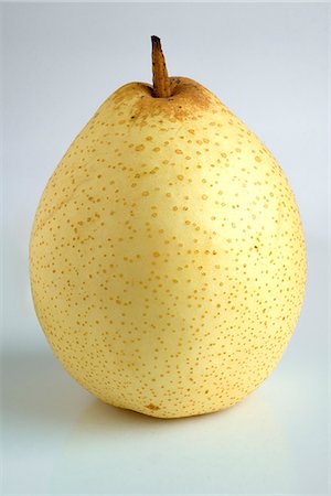 pear - An Asian pear against a white background Stock Photo - Premium Royalty-Free, Code: 659-07027515