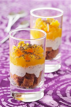 A layered dessert with oranges, gingerbread, whipped cream and poppy seeds Stock Photo - Premium Royalty-Free, Code: 659-07027775