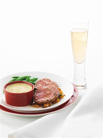 effervescent - Lamb fillet with sugar snap peas and potato gratin Stock Photo - Premium Royalty-Free, Code: 659-07027835