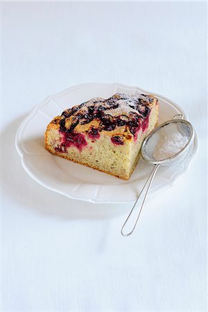 simsearch:659-01848790,k - A slice of blueberry cake dusted with icing sugar Stock Photo - Premium Royalty-Free, Code: 659-07028306