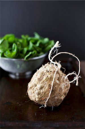 simsearch:659-07609605,k - Celery Root with Fresh Spinach in the Background Stock Photo - Premium Royalty-Free, Code: 659-07028539