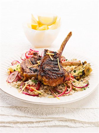 simsearch:659-08148038,k - Spicy lamb chops with harissa on a bed of couscous Stock Photo - Premium Royalty-Free, Code: 659-07028713