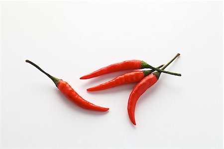 Four red chillies Photographie de stock - Premium Libres de Droits, Code: 659-07028775