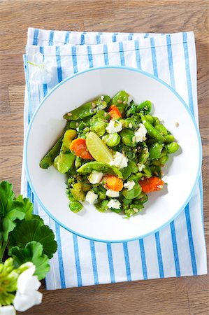 Bean salad with broad beans, peas, carrots, feta and limes Stock Photo - Premium Royalty-Free, Code: 659-07028930