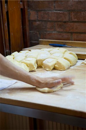 Hands shaping bread rolls in a bakery Stock Photo - Premium Royalty-Free, Code: 659-07068800