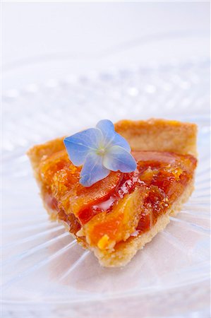 simsearch:659-01848790,k - A slice of orange tart with a blue hydrangea flower Stock Photo - Premium Royalty-Free, Code: 659-07069164