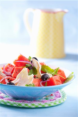red watermelon - Watermelon salad with goat's cheese, red onions, olives and rocket Stock Photo - Premium Royalty-Free, Code: 659-07069178