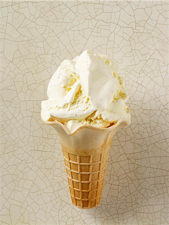 simsearch:659-08418689,k - Vanilla ice cream in an ice cream cone Stock Photo - Premium Royalty-Free, Code: 659-07069458