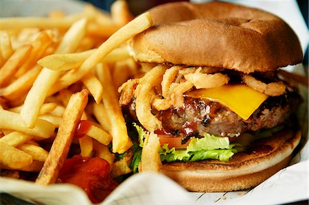 food and fast food - Cheeseburger with French Fries and Ketchup Stock Photo - Premium Royalty-Free, Code: 659-07069745