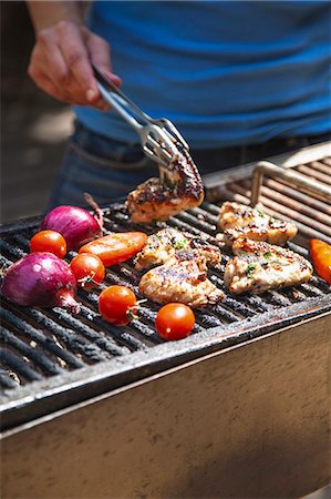 Chicken wings and vegetables on the barbecue Stock Photo - Premium Royalty-Free, Code: 659-07597165