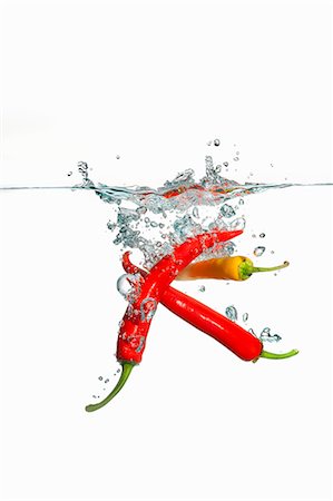simsearch:659-06154334,k - Chillies falling into water Stock Photo - Premium Royalty-Free, Code: 659-07597243