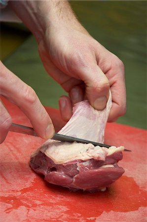 The skin being removed from a piece of meat Stock Photo - Premium Royalty-Free, Code: 659-07597502