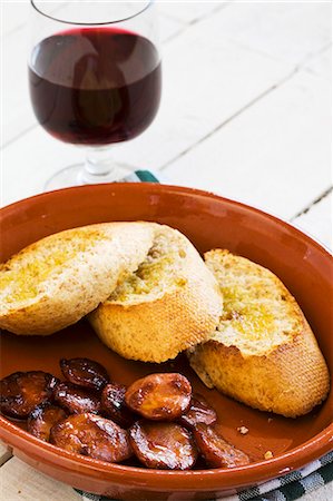 Pinchos with chorizo, served with red wine (Spain) Stock Photo - Premium Royalty-Free, Code: 659-07597575