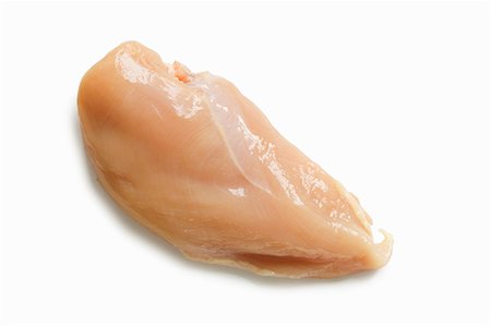 A Single Raw Chicken Breast on a White Background Stock Photo - Premium Royalty-Free, Code: 659-07597693