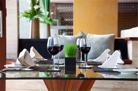 simsearch:659-06184015,k - A table laid for a meal with four place settings and glasses of red wine Stock Photo - Premium Royalty-Free, Code: 659-07597728