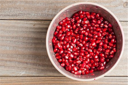 punica granatum - Pomegranate seeds in a bowl Stock Photo - Premium Royalty-Free, Code: 659-07597797