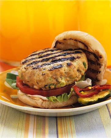 Barbecued chicken burger in a bun Stock Photo - Premium Royalty-Free, Code: 659-07597869