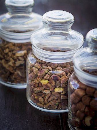 pistachio - Pistachio nuts in a jar among other kinds of nuts. Stock Photo - Premium Royalty-Free, Code: 659-07598274