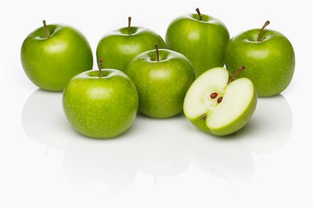 simsearch:659-07610418,k - Several Granny Smith apples, whole and cut in half Stock Photo - Premium Royalty-Free, Code: 659-07598814