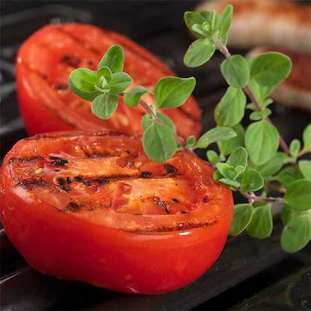 Grilled tomatoes with fresh oregano Stock Photo - Premium Royalty-Free, Code: 659-07598878